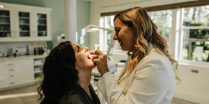 Dentist examining a patient with a chipped tooth