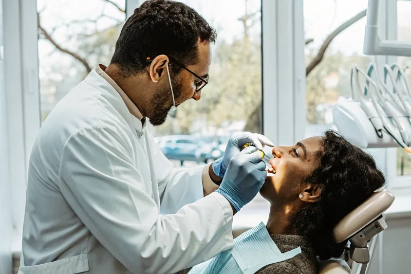 Dentist discussing sleep apnea oral appliance care with a patient