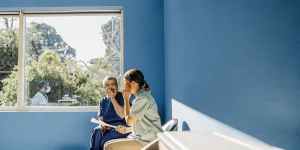 Patient consulting with dentist about tooth pain in a modern dental office