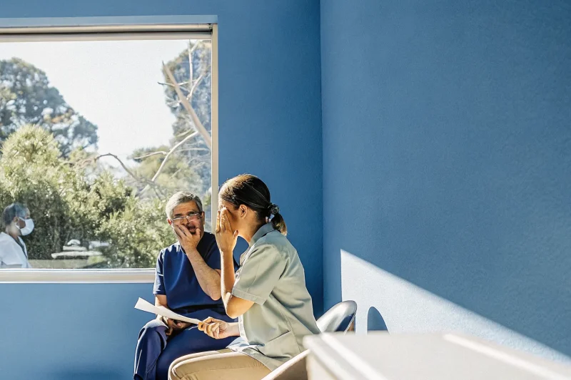Patient consulting with dentist about tooth pain in a modern dental office