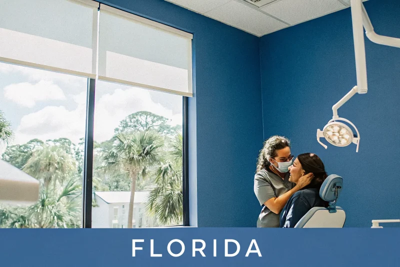 Dentist comforting a patient with tooth pain in a modern dental office